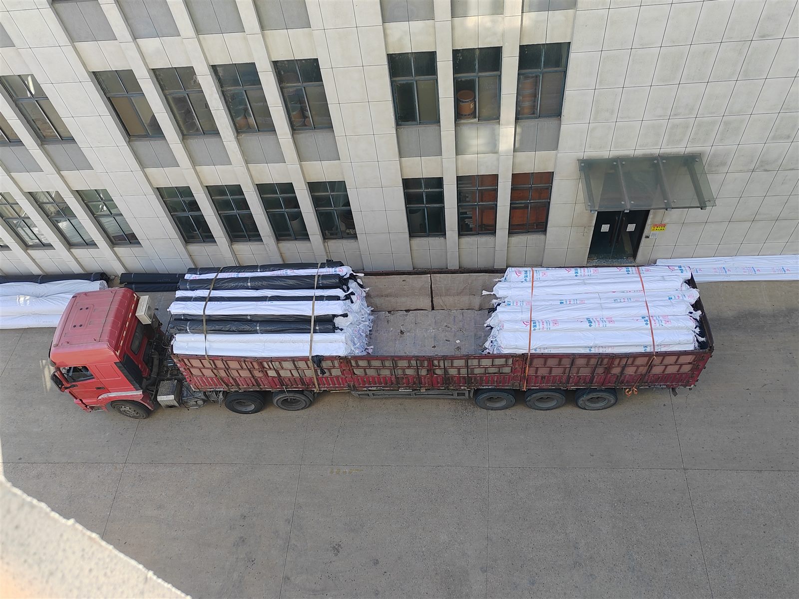 Long-length stock loaded and secured for transport